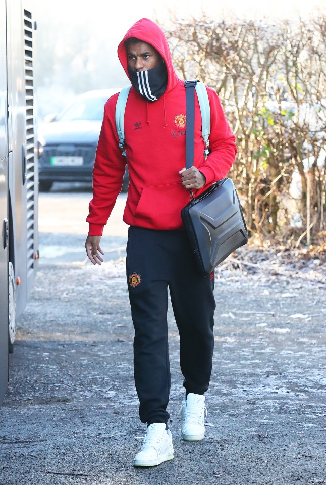 Marcus Rashford appeared to be feeling the cold as he boarded the coach