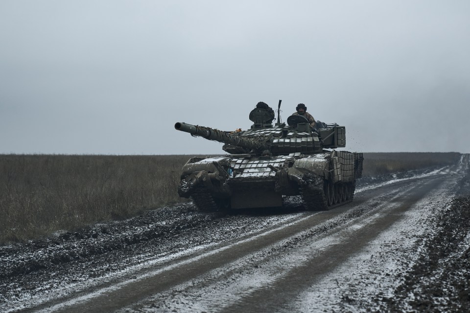 A Ukrainian tank drives along a frozen field last week close to Avdiivka