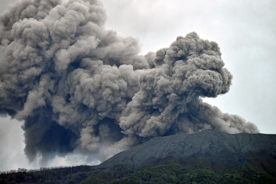 Volcanic ash spews from Mount Marapi during an eruption