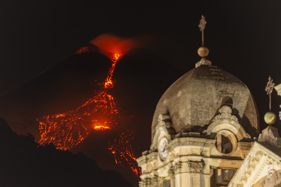 Mount Etna sent 1,000C lava cascading down the volcano and lighting up the Italian night sky