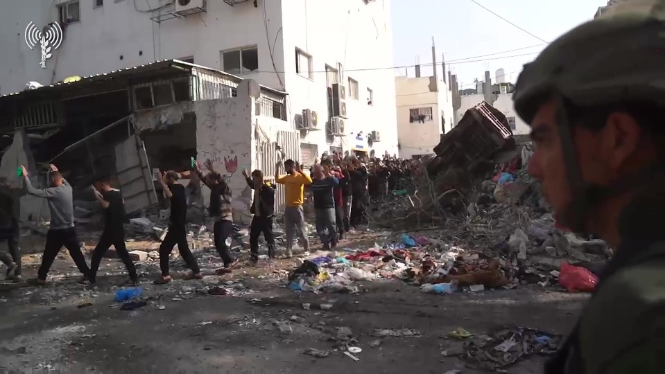 Footage appeared to show a long line of Palestinian gunmen surrender to IDF troops at a hospital in northern Gaza