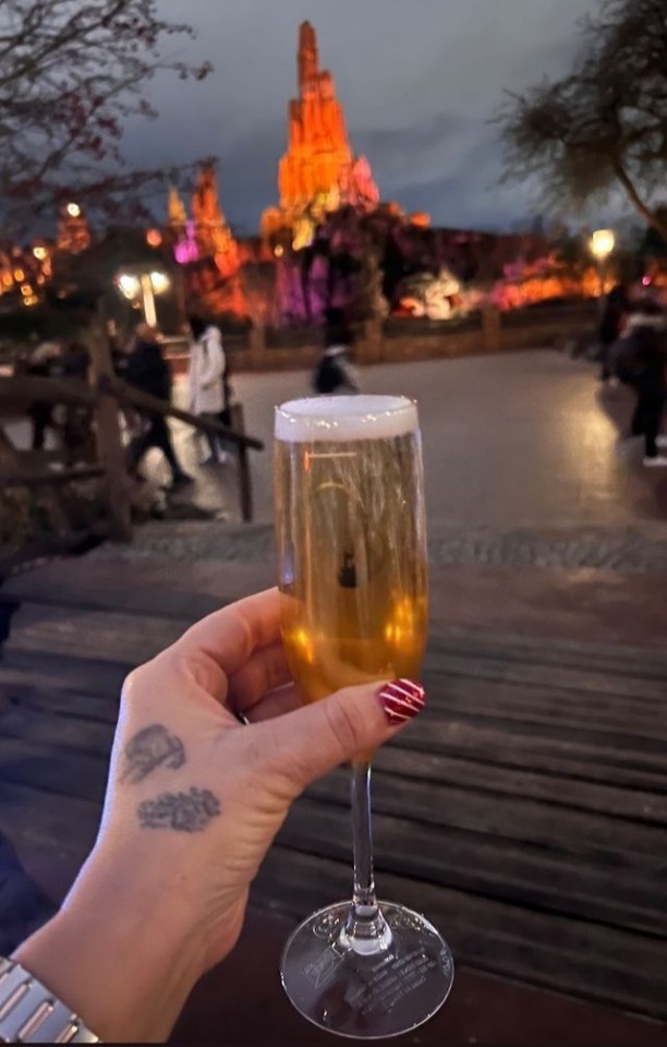 Sue even managed to squeeze in a glass of bubbly with the Disney castle in the background