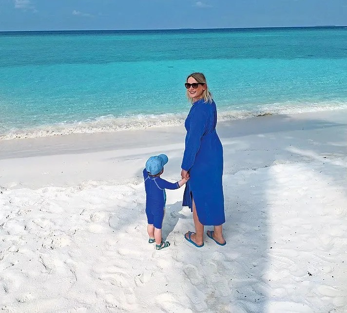 Catherine explores the idyllic beach with her son Raffy