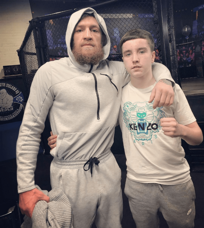 McGregor poses in the gym with Kelly