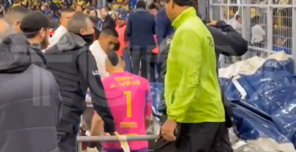 He made his way off the pitch where he was directed towards an advertising blanket