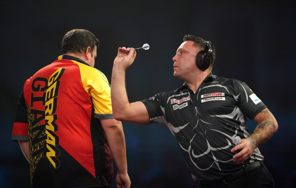 Gerwyn Price can be seen wearing ear defenders during his match against Gabriel Clemens on day fourteen of the Cazoo World Darts Championship at Alexandra Palace, London. Picture date: Sunday January 1, 2023. PA Photo. See PA story DARTS World. Photo credit should read: Zac Goodwin/PA Wire. RESTRICTIONS: Use subject to restrictions. Editorial use only, no commercial use without prior consent from rights holder.