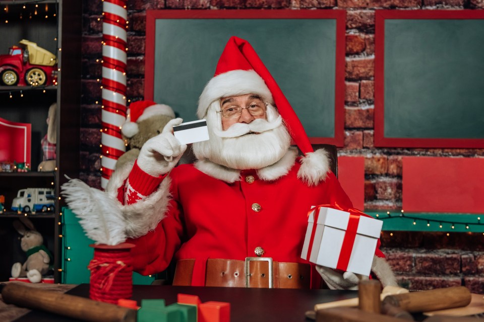 Santa Claus suggests using a credit card to buy Christmas gifts and toys