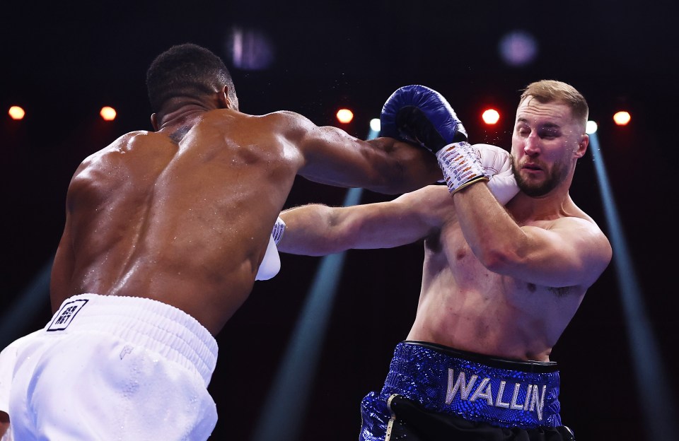 RIYADH, SAUDI ARABIA - DECEMBER 23: Anthony Joshua and Otto Wallin exchange punches during the Heavyweight fight between Anthony Joshua and Otto Wallin during the Day of Reckoning: Fight Night at Kingdom Arena on December 23, 2023 in Riyadh, Saudi Arabia. (Photo by Richard Pelham/Getty Images)