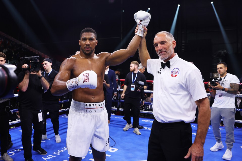 RIYADH, SAUDI ARABIA - DECEMBER 23: Anthony Joshua celebrates victory as Referee Steve Gray announces him as winner following the Heavyweight fight between Anthony Joshua and Otto Wallin during the Day of Reckoning: Fight Night at Kingdom Arena on December 23, 2023 in Riyadh, Saudi Arabia. (Photo by Richard Pelham/Getty Images)