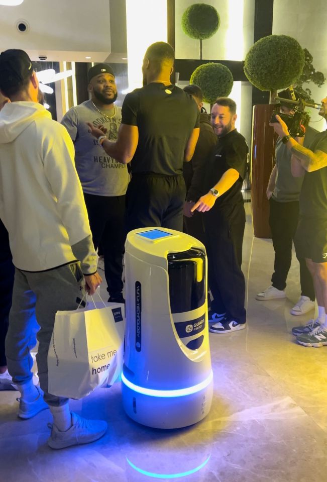 Anthony Joshua was bumped into by a robot as he squared up to Miller