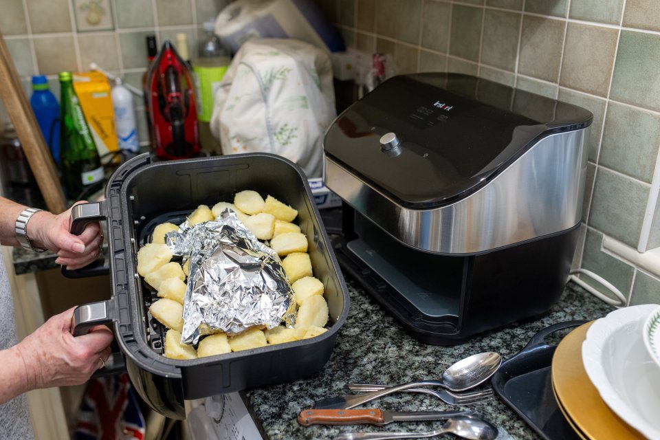 Beverley Jarvis who is cooking a full Christmas dinner just using air fryers. Ashford, Kent. See SWNS story SWTPairfryer. Meet the great-grandmother will be cooking her entire Christmas dinner in an air fryer this year because its 'cheaper, easier - and makes the best ever roast potatoes'. Beverley Jarvis, 74, is a cooking a festive three-course meal for eight using her Instant Vortex Plus machine. An air fryer expert, she hopes to convert the nation - and has already had the backing of Great British Bake Off star Prue Leith. Beverley, from Ashford Kent, started using the kitchen gadget after her son bought her one - and quickly fell in love.