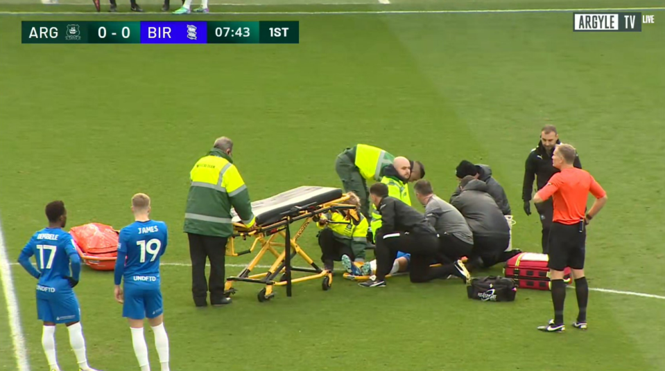 The left-back was stretchered off