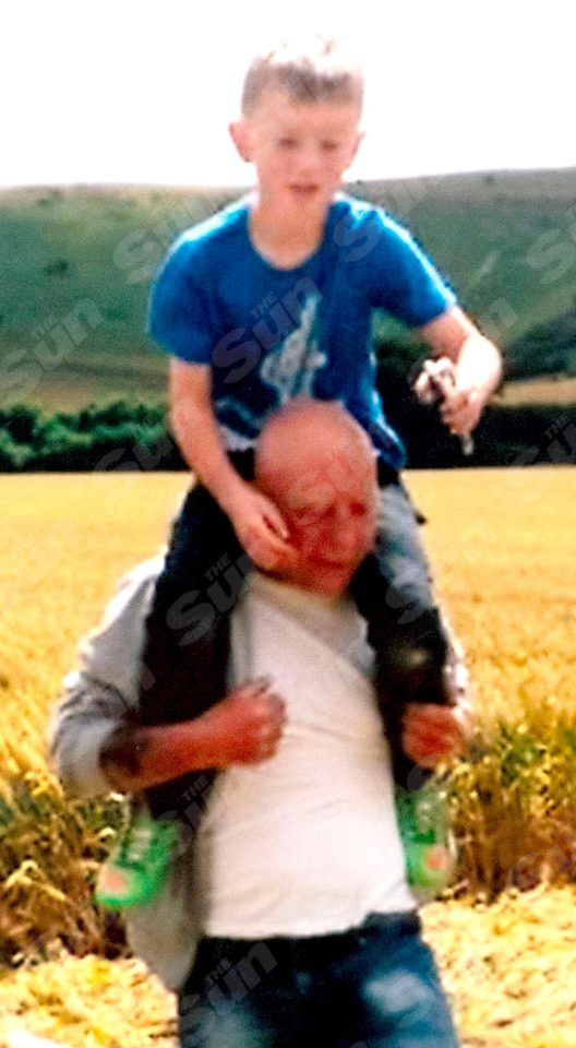 More of Alex’s pics show him on grandad David’s shoulders