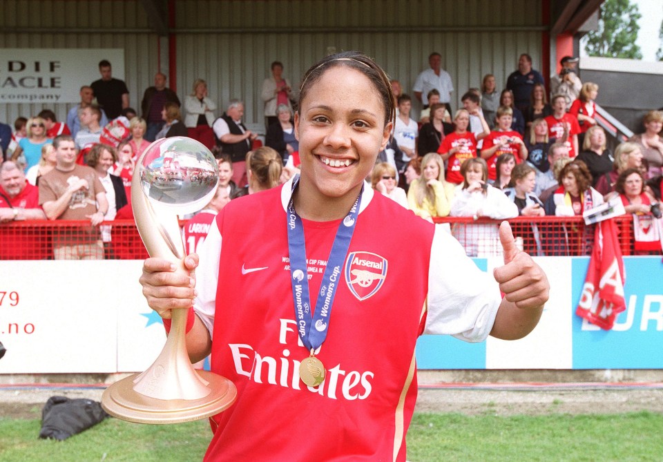 Alex Scott clutches the Women's Champions League