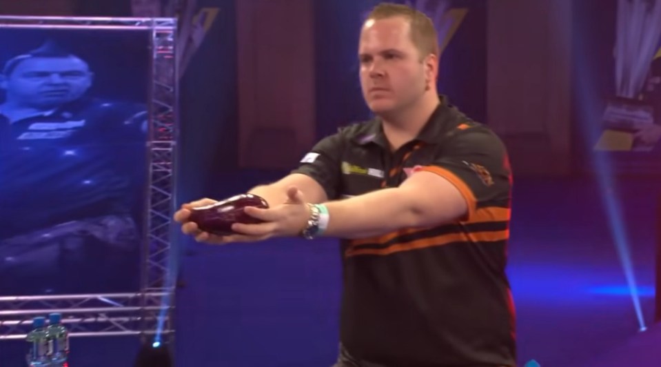 Darts superstar Dirk van Duijvenbode’s entrance sees him carrying an aubergine