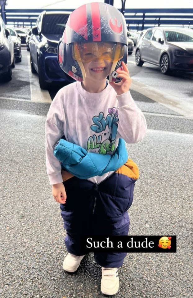 As she said her little boy was "such a dude" as he posed in a helmet