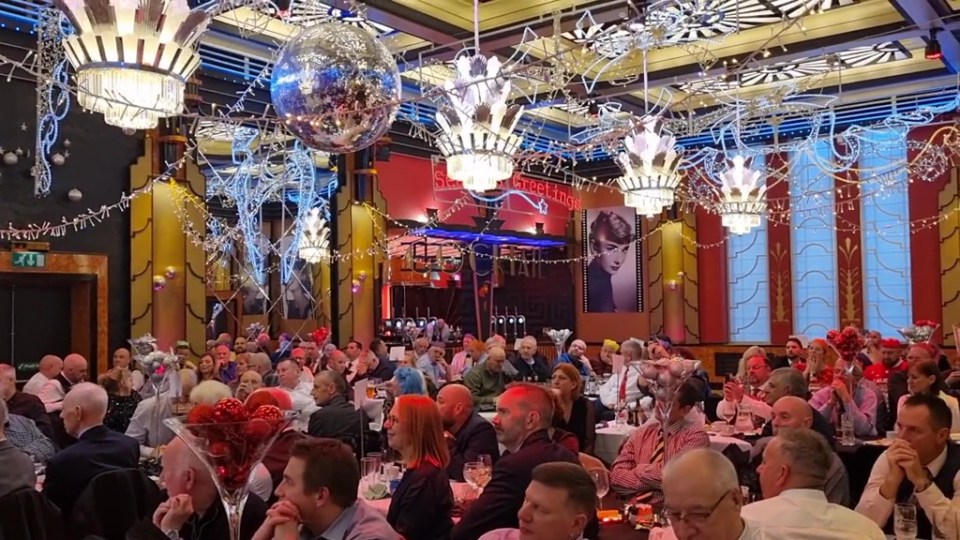 Rail union bosses getting stuck into free food and booze at their annual Christmas bash