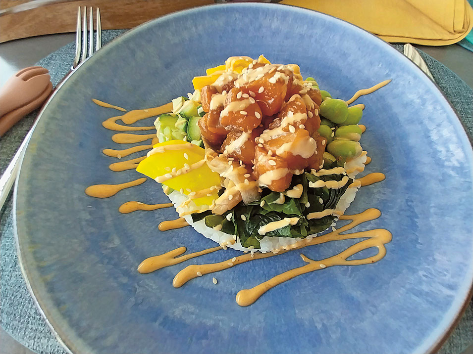 Tuck into plates of Maldivian tuna with rice crisps and mango