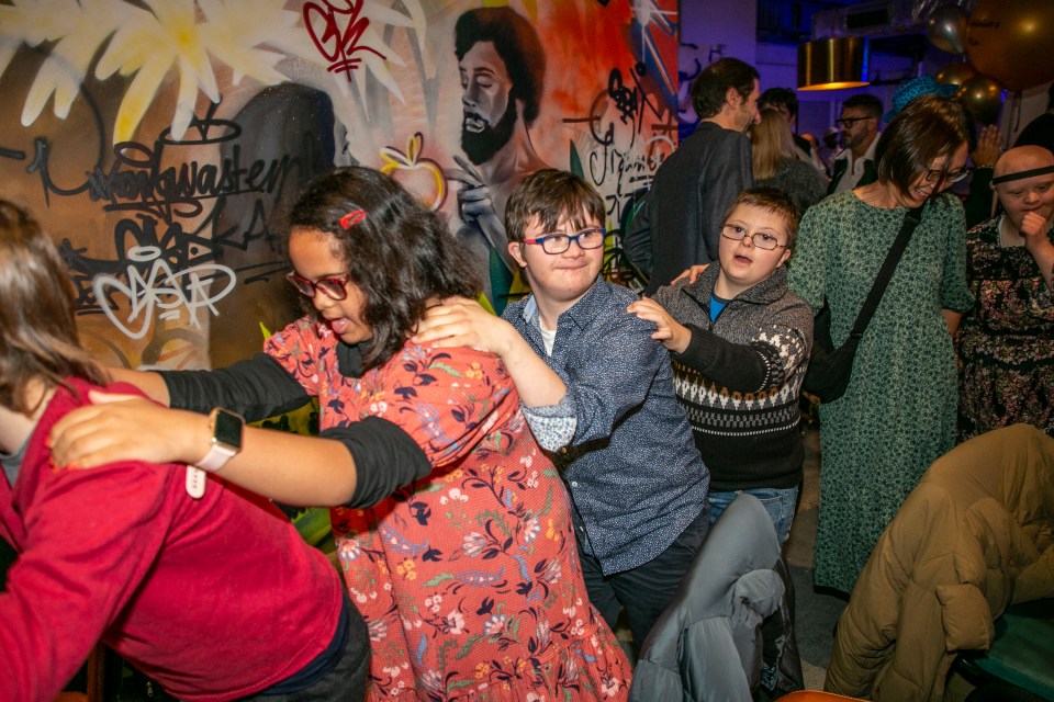 Youngsters formed a conga as they danced to music played by a live DJ