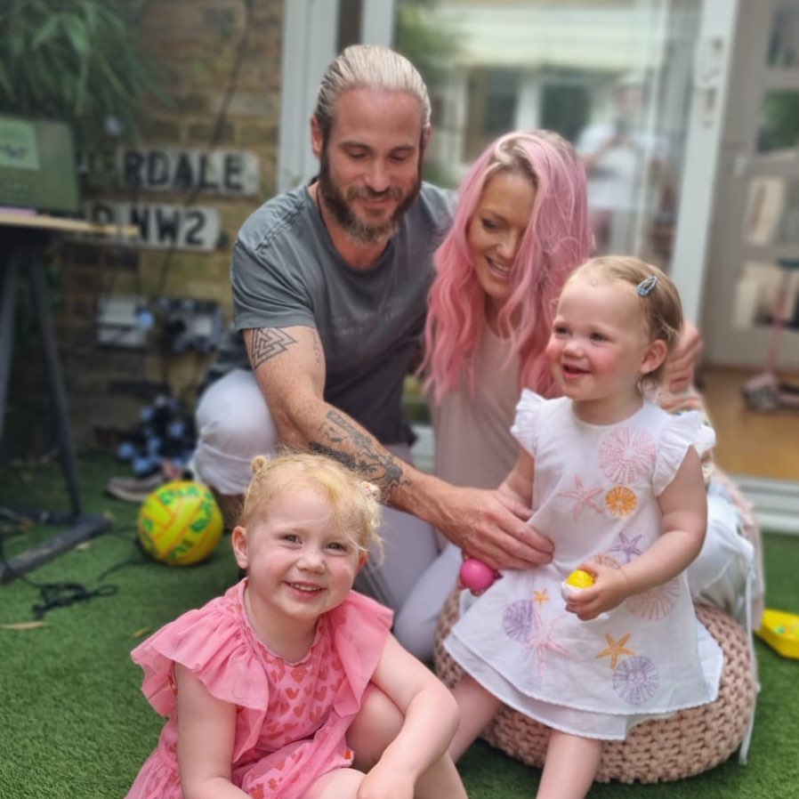 Hannah with her partner and two daughters