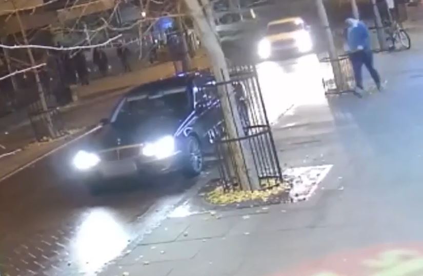 Video shows a black Mercedes driven by one of the men waiting for the other as he legs it down the street