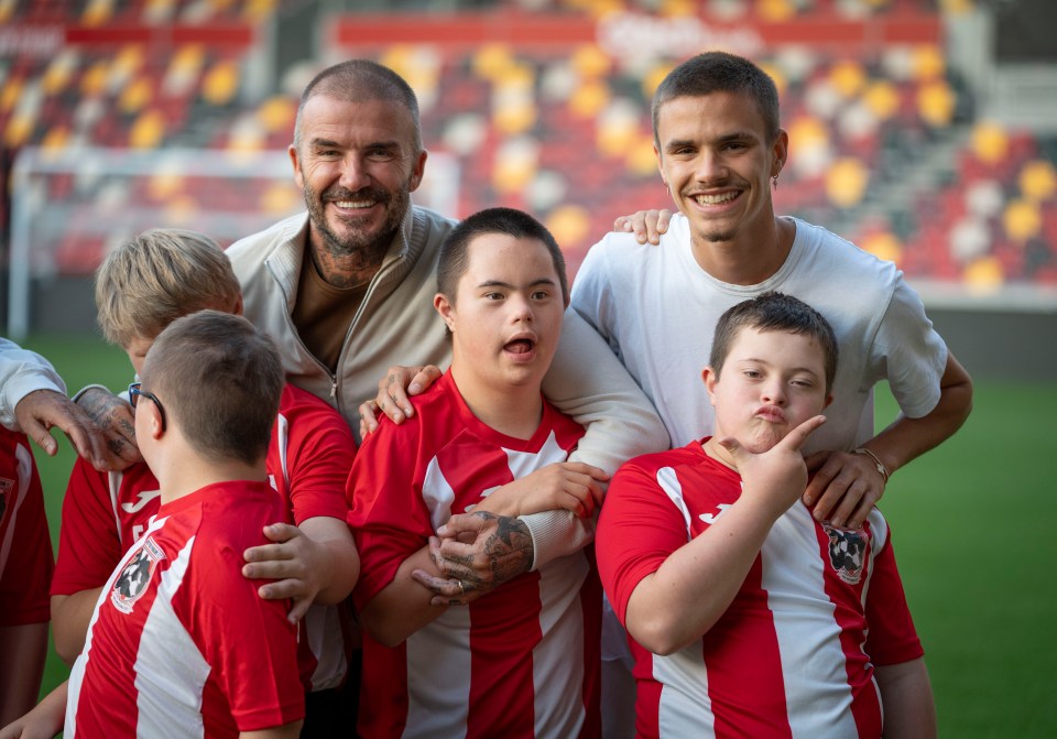 Allan was surprised with his Unsung Hero award by David Beckham and his son Romeo