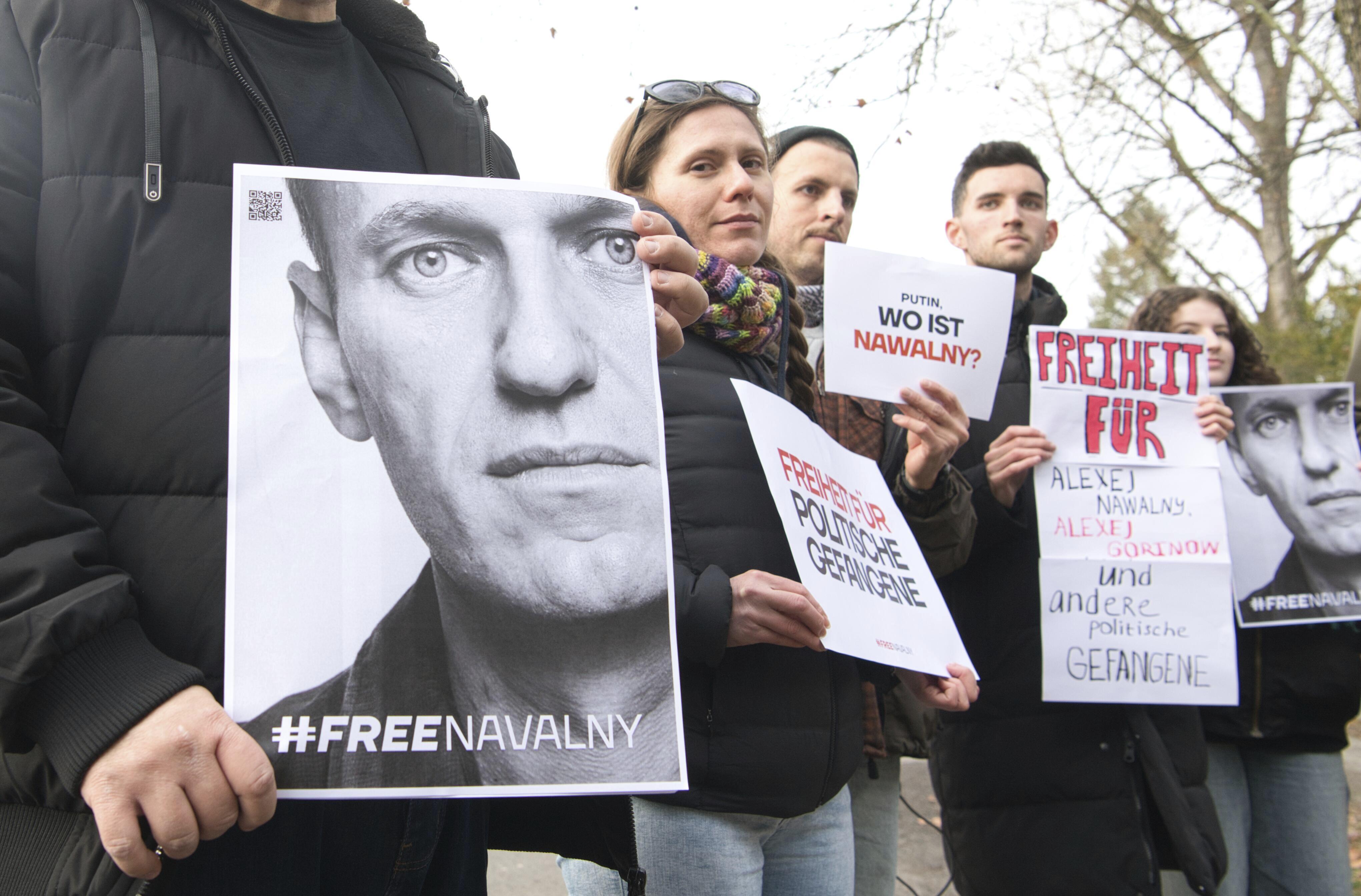 Protesters gather outside the home of Russian ambassador Sergei Netshaev in Berlin on December 16 after Navalny's disappearance