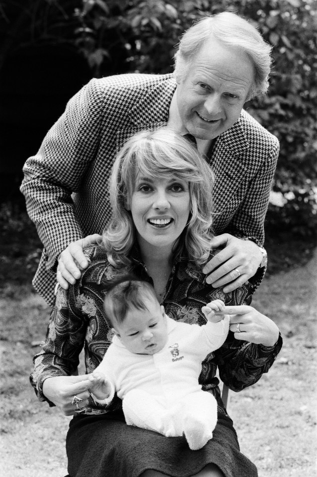 Esther at home with her baby daughter Emily and husband Desmond in May 1978