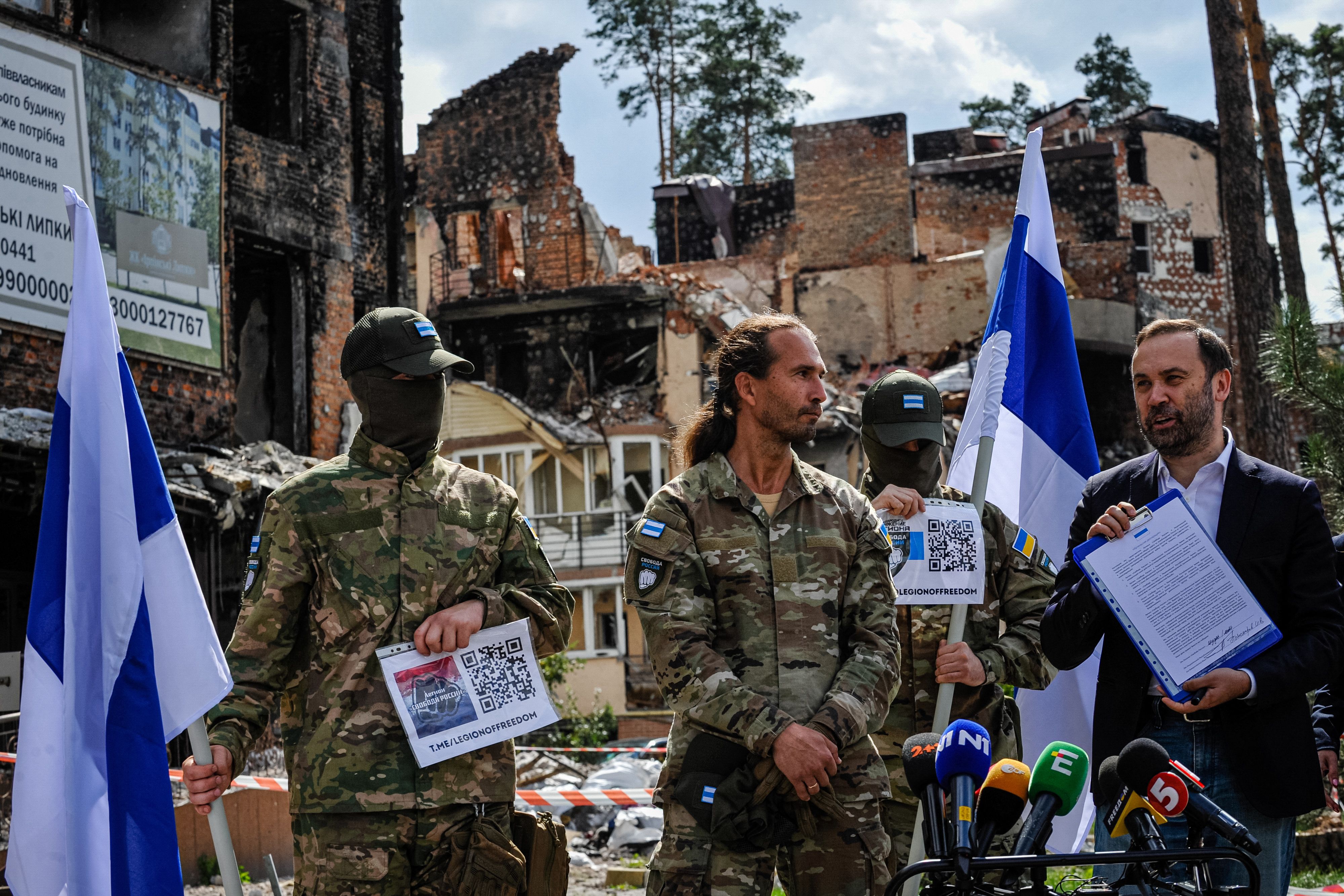 Caesar pictured next to the political head of Russian resistance, Ilya Ponomarev