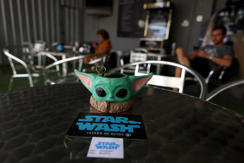 A flowerpot in the shape of a ‘Star Wars’ character is placed next to a sticker