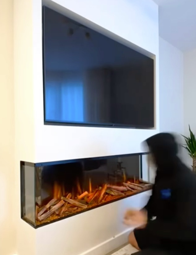 She had a TV and a fireplace installed into the wall