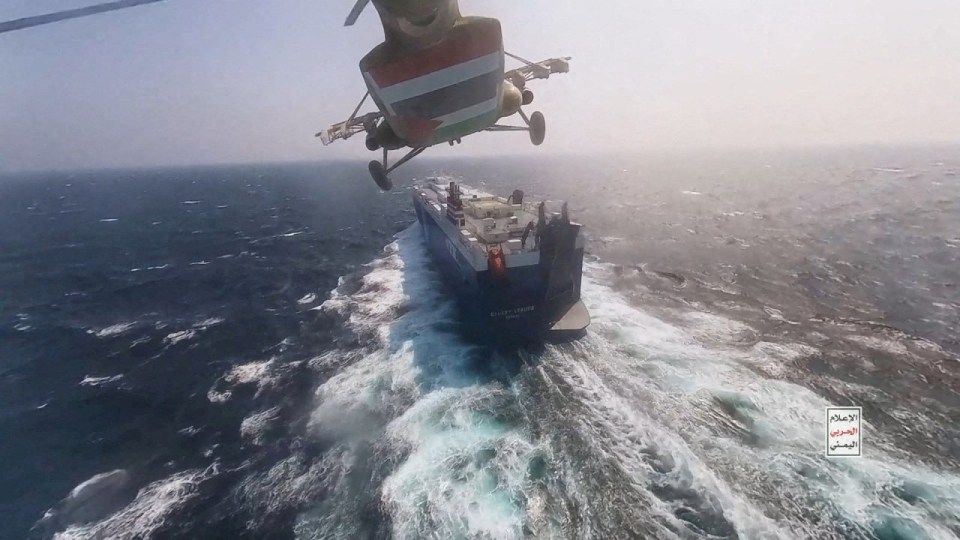 Houthi rebels approaching a ship in the Red Sea before storming the deck in November