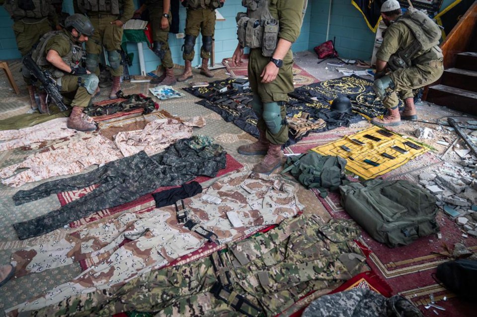 IDF handout pictures showing Hamas gear in a home