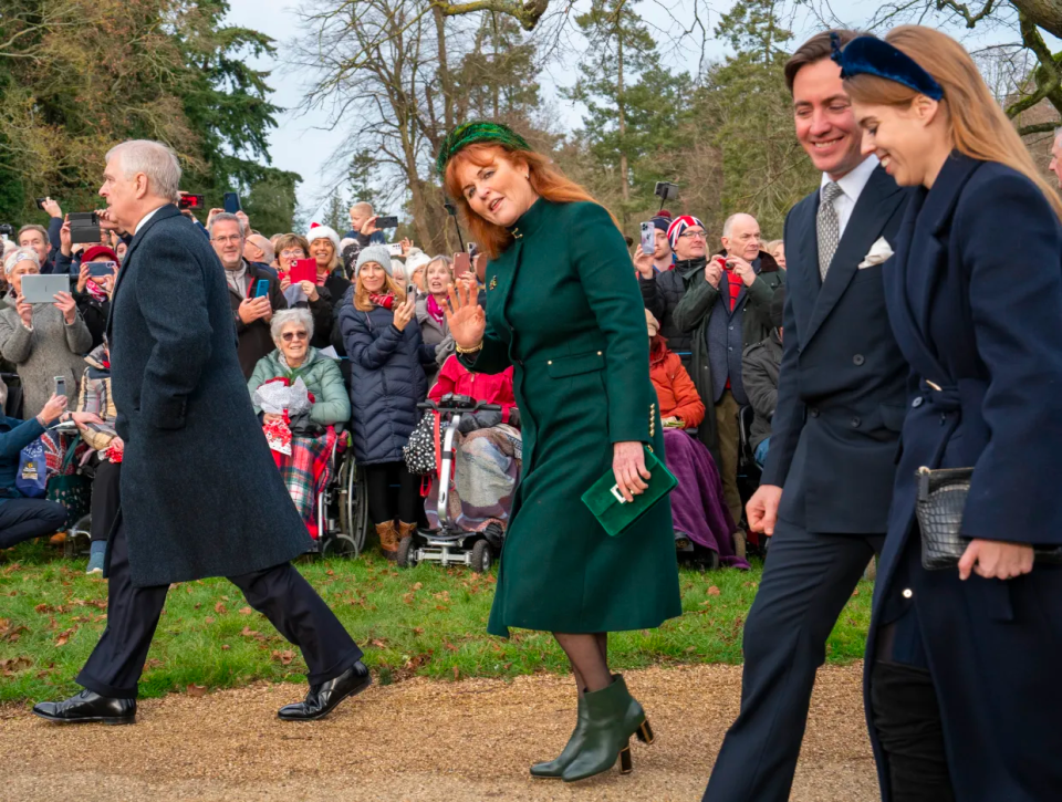 Prince Andrew walked awkwardly by himself