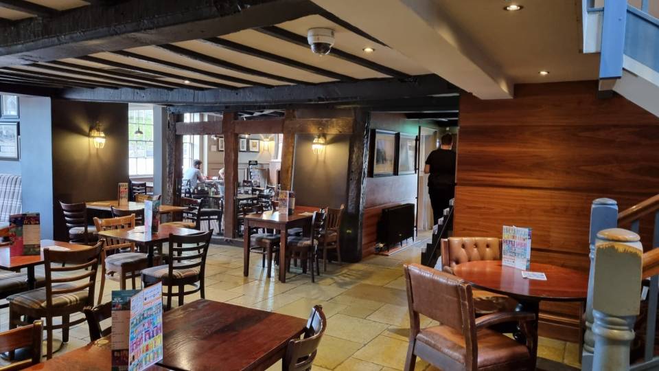 The interior of the pub has low wooden ceilings