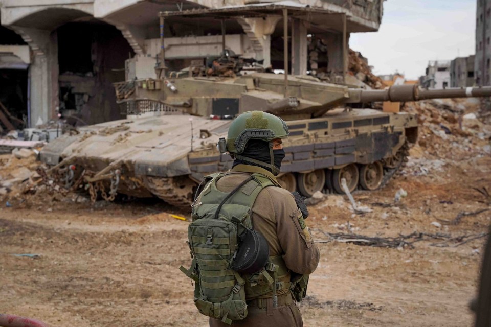 An Israeli soldier looks on as they operate in Gaza after a temporary truce ended