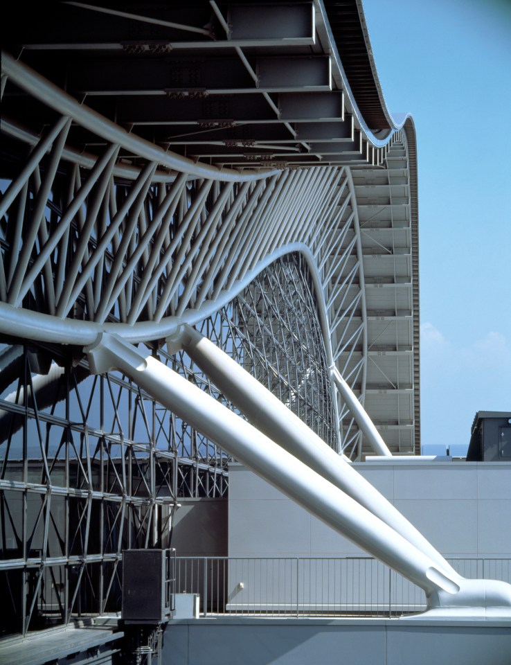 The building has a unique shape and is designed to resemble the wing of a glider