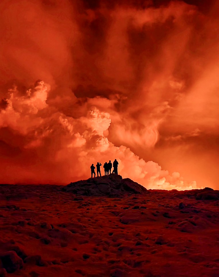 Locals watch the volcano despite repeated warnings from officials