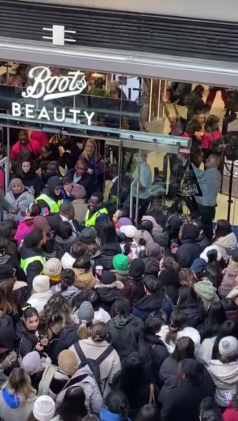 The chaos outside the new Boots store at the redeveloped Battersea Power Station, as shoppers scramble to grab one of 200 goody bags worth £300