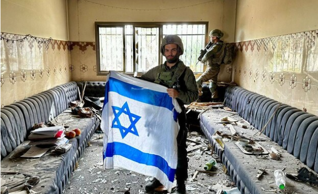 IDF soldiers pose inside his house as the net tightens on the terror warlord