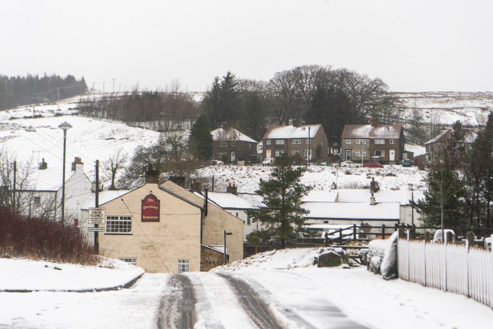 Thick snow blankets the village of Nenthead in Cumbria