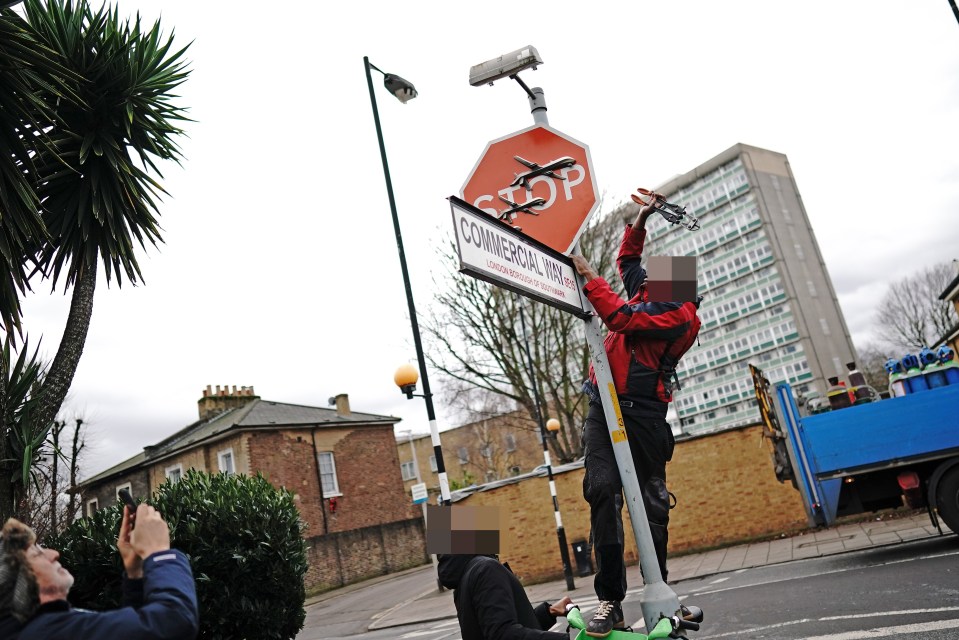 Police are probing the alleged theft of a £500,000 Banksy artwork after a man was seen cutting it down with bolt cutters