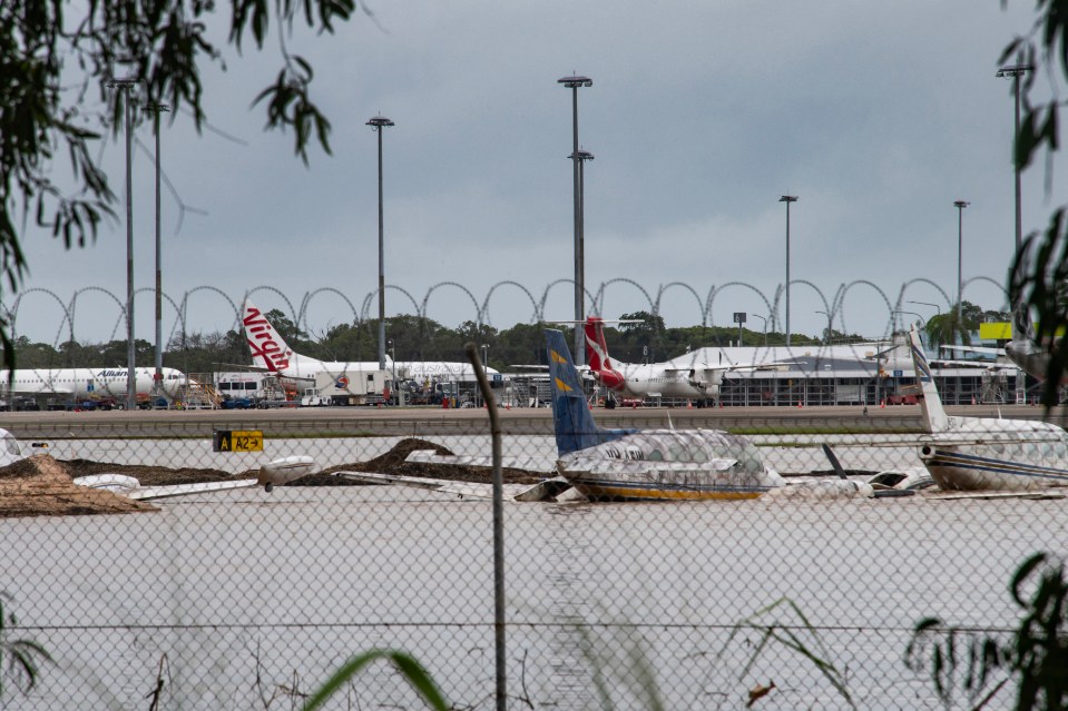 Planes were submerged by floodwater at Cairns airport