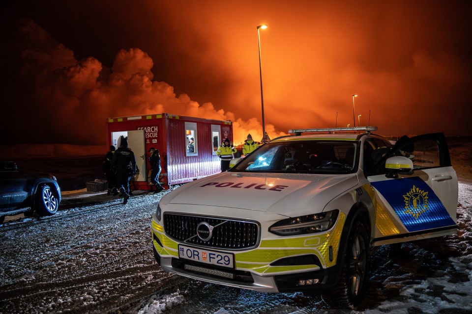 Police at the entrance of the road to Grindavik - where thousands of people were evacuated