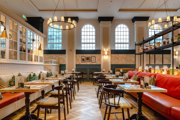 the inside of a restaurant with tables and chairs