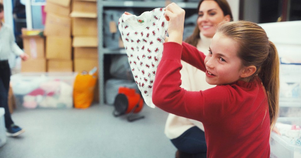 Charlotte helping her mum at the Baby Bank