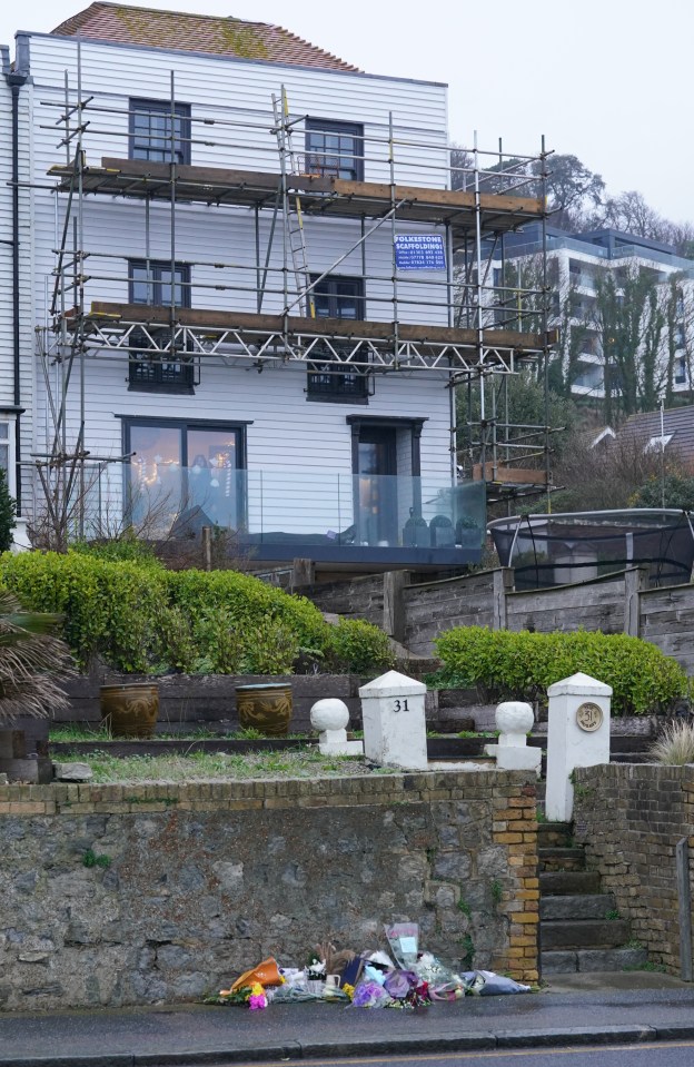 Flowers are left near Brown's home in Sandgate, near Folkestone