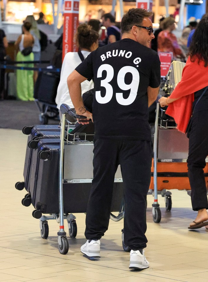 He was spotted checking in at Brisbane Airport in a Newcastle United shirt