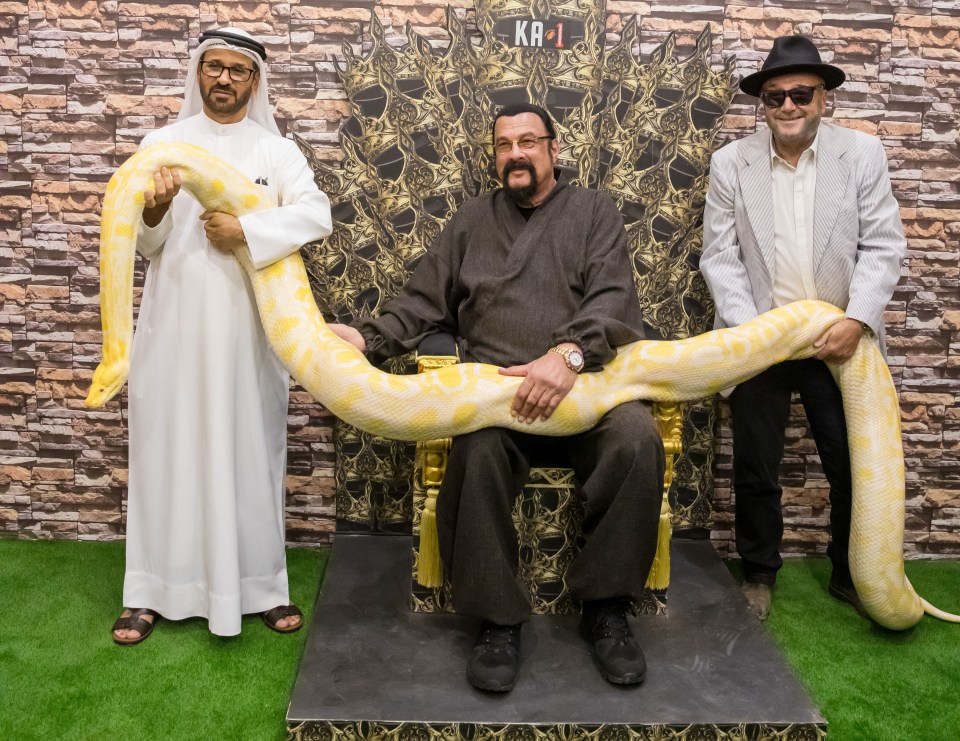 The pair were also snapped holding a gigantic snake