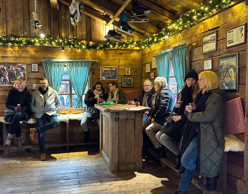 A make-believe Alpine ski chalet, vintage skating boots hanging from the ceiling amid tinsel and twinkly lights